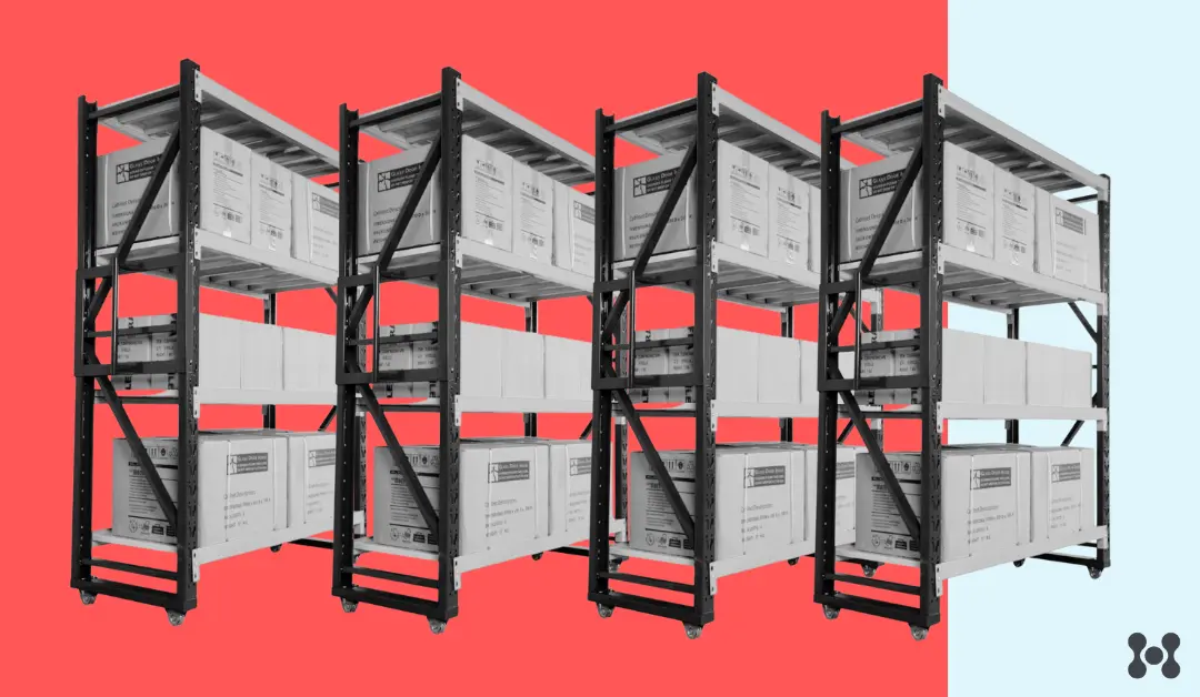 Four industrial metal shelving units are shown, loaded with shipping boxes. The shelving units and boxes are in black and white over a red background. 